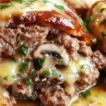 A savory mushroom meatloaf topped with melted Swiss cheese, sliced to reveal a moist interior filled with hearty chunks of mushrooms and herbs, placed on a rustic wooden platter with fresh herbs and a side of roasted vegetables.