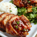 Glossy Char Siu Chicken glazed in a deep red lacquer, sliced to reveal juicy interior, sesame seeds and chopped scallions sprinkled on top, plated on a white dish with jasmine rice and crisp greens, set on a warm wooden board with subtle grill marks.